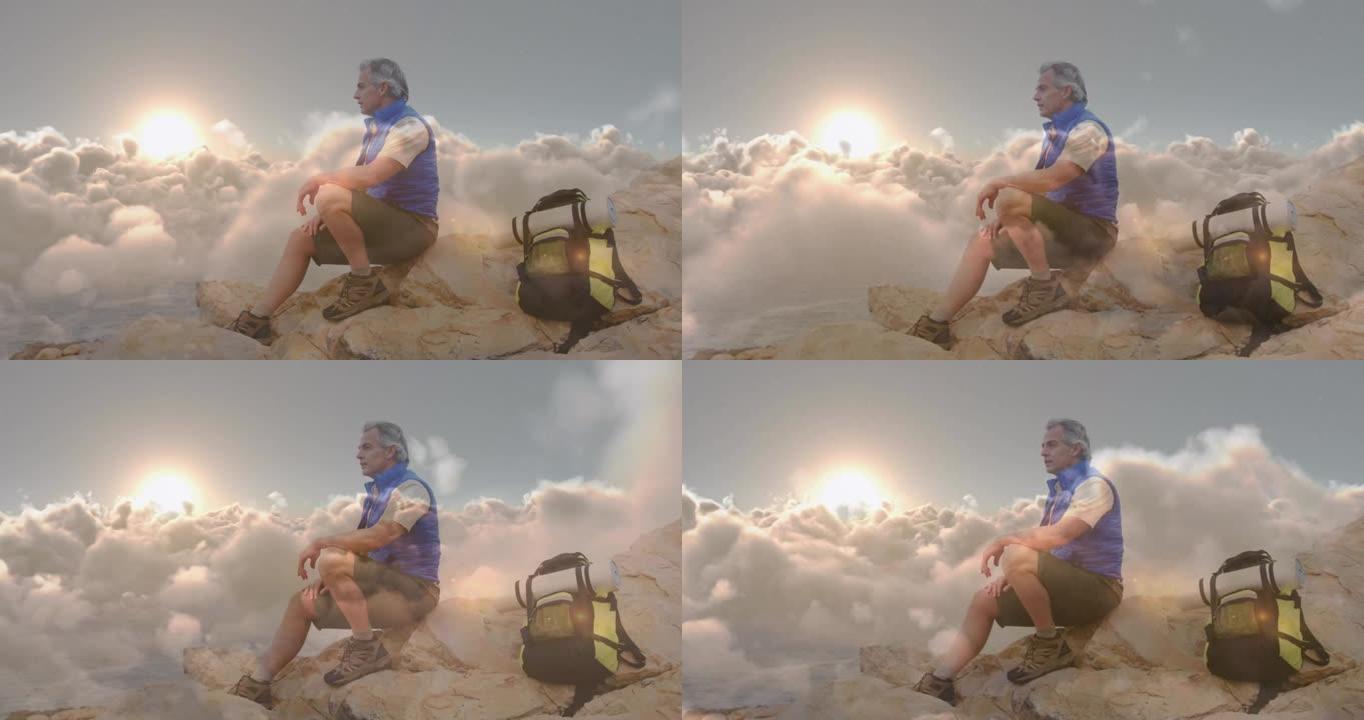 快乐的高加索高级男子在快速移动的云层上徒步旅行