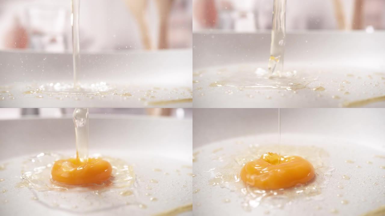 炒鸡蛋生鸡蛋或煎蛋宏观慢动作落在煎锅上