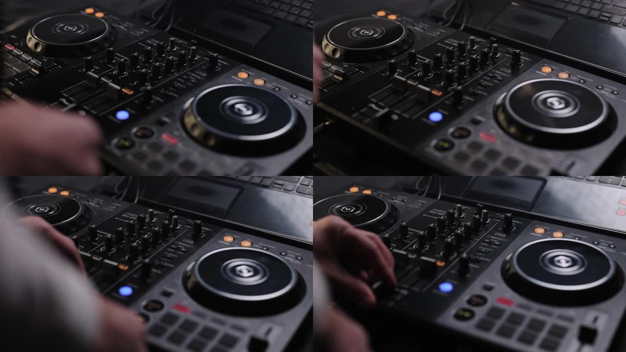 混合控制器在乙烯基板上组成新的混合物。DJ音响控制台，用于在迪斯科俱乐部混合舞蹈音乐。手触摸按钮滑块