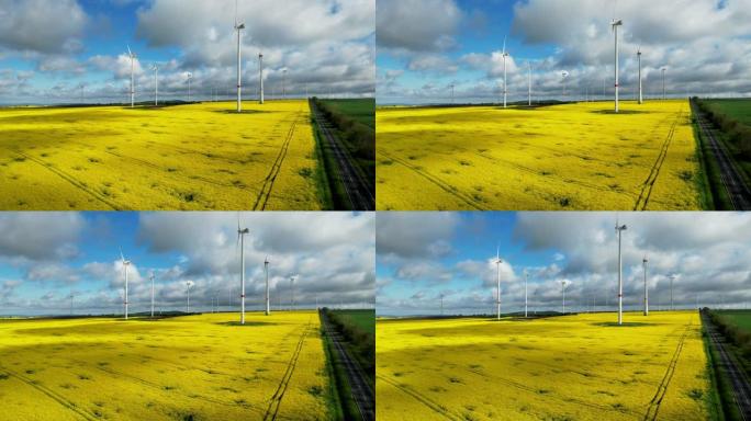 风力涡轮机和盛开的黄色油菜籽田的鸟瞰图