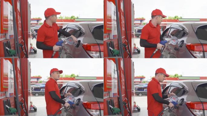 一个高加索人，人，工人在加油站使用汽油泵加油，加油石油和能源汽车业务服务中的运输概念。