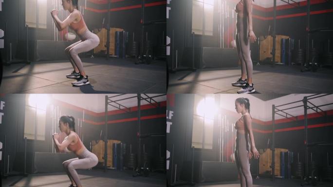 运动的亚洲女性运动做蹲下体重训练锻炼肌肉和燃烧脂肪有氧运动，健身健身房的健康生活方式