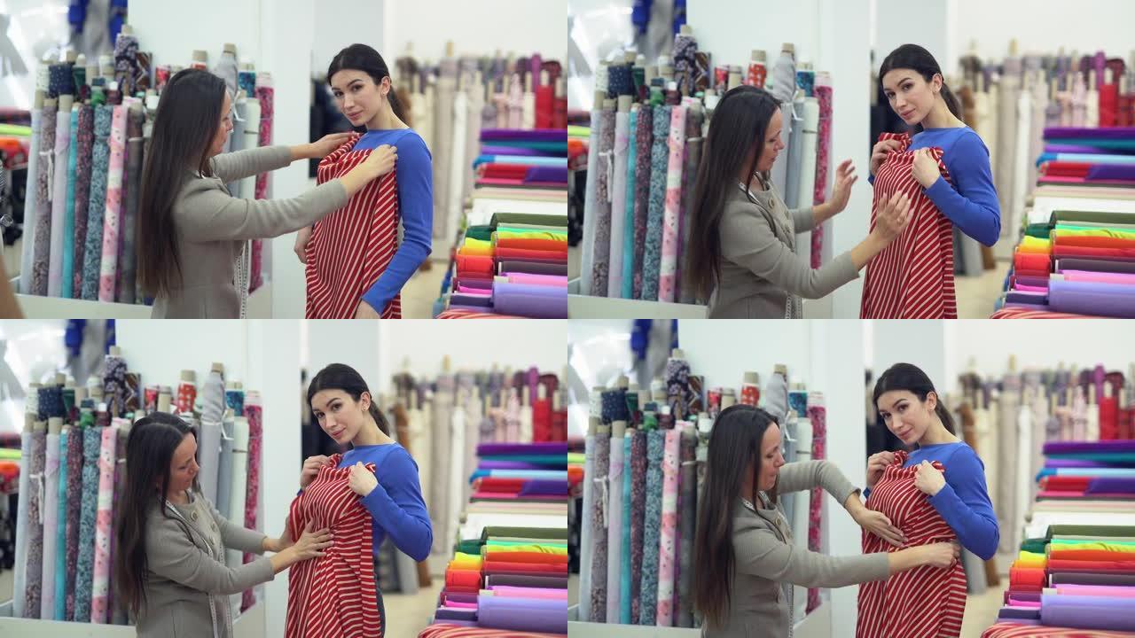 纺织品商店卖家建议女性买家。线下购物