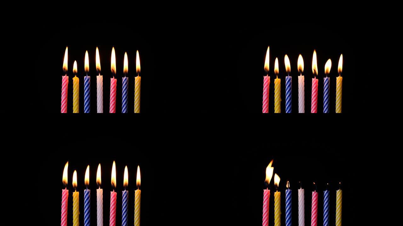 黑色背景上的生日蜡烛集合，周年庆典概念