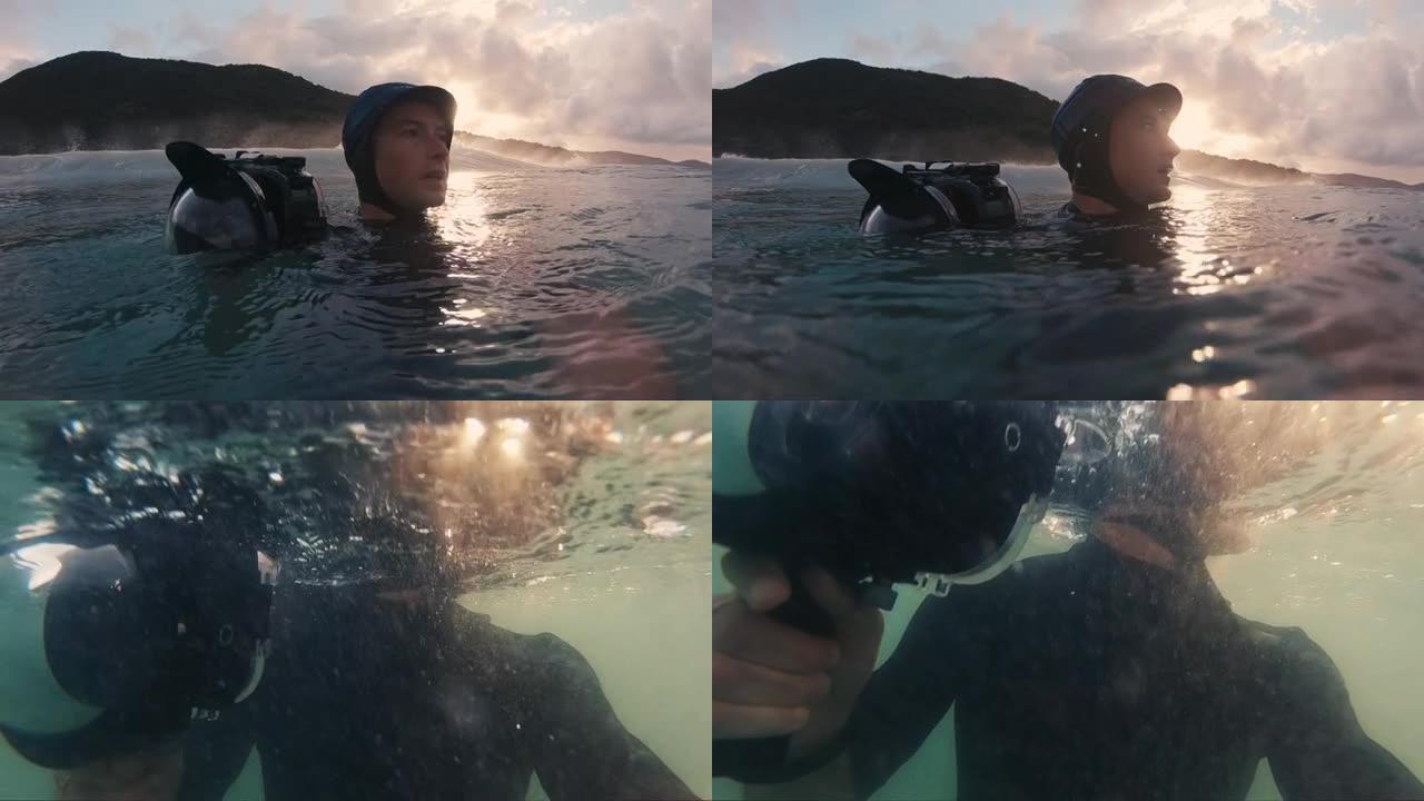 惊讶的冲浪摄影师。戴着蓝色帽子的男人带着运动相机在海里游泳，环顾四周