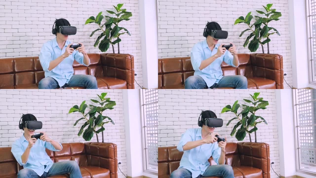 坐在家里客厅沙发上的虚拟现实耳机玩视频游戏的亚洲男人