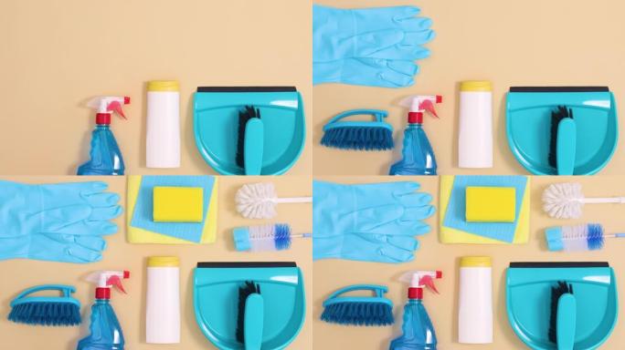 米色背景下的清洁工具和家用卫生创意布局。停止运动