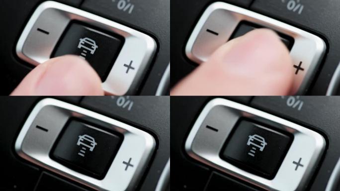 手指按下按钮启动自动巡航控制自动驾驶仪。自动驾驶汽车使用传感器，导航与交通感知巡航控制和自动驾驶
