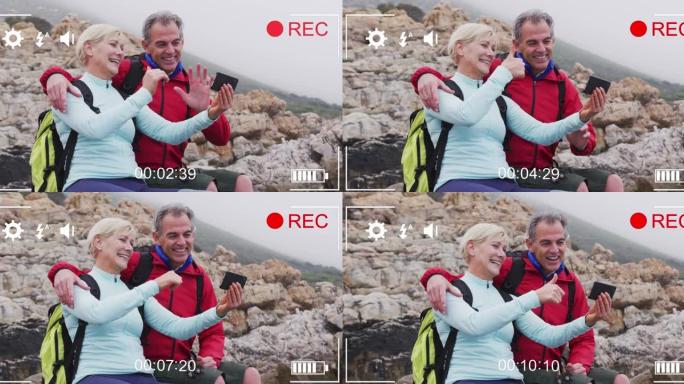 在海边拍摄自拍照的快乐高加索高级夫妇上的智能手机视频界面屏幕