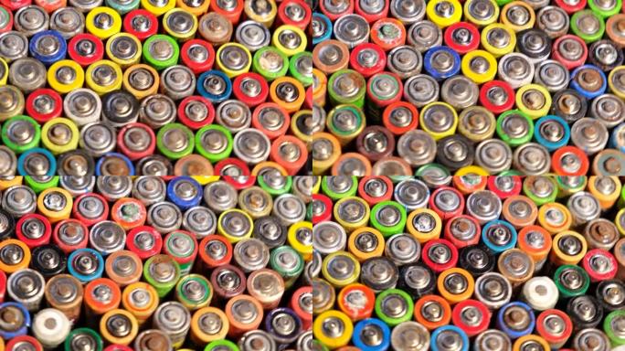 堆中AA废旧电池的类型。对环境的高度危险。