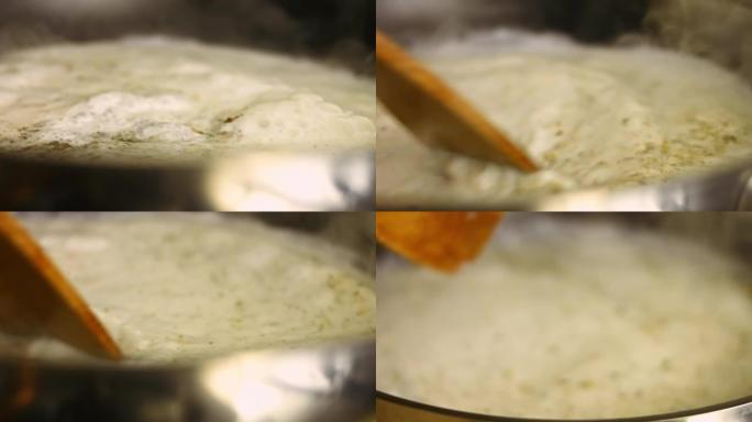 为烤箱烤鸡准备酱汁。用木铲搅拌。烹饪shkmeruli格鲁吉亚菜的过程。宏观视图