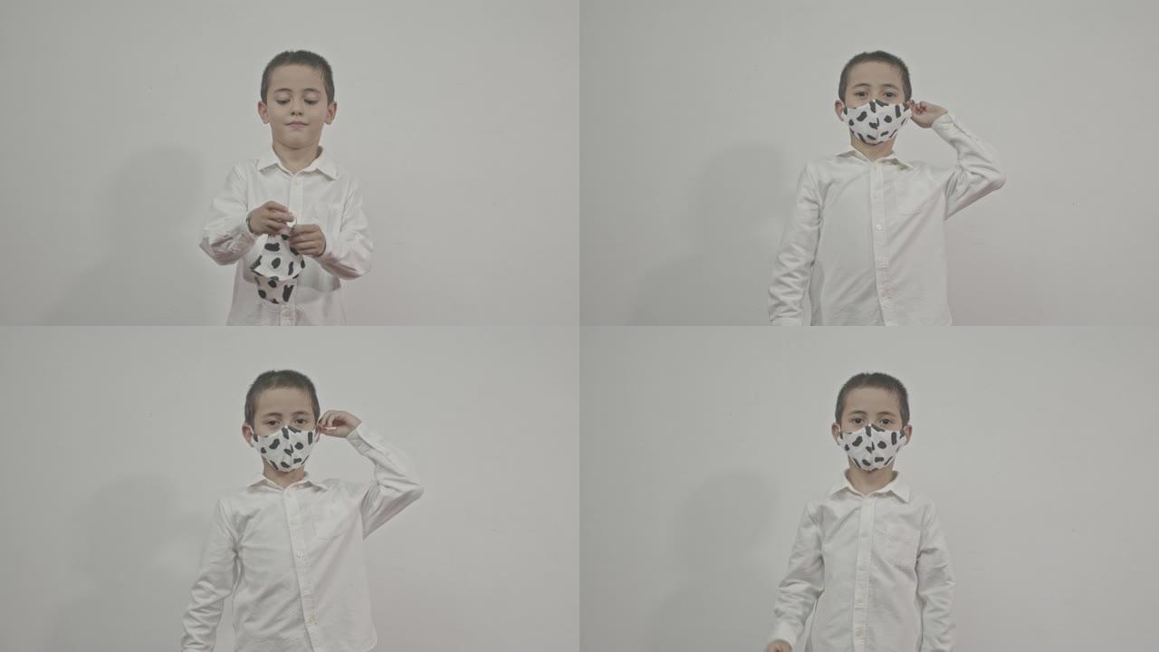 一个男孩演示如何戴匿名面具。