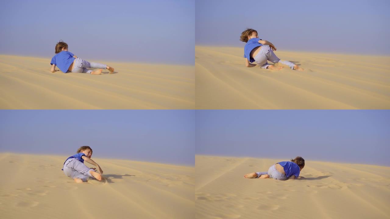 小男孩在沙漠里玩得很开心
