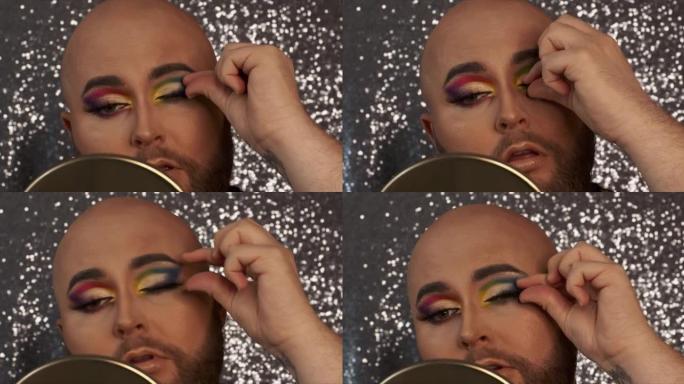 一名男性化妆师在自己的睫毛上涂抹假骨灰的4k视频片段