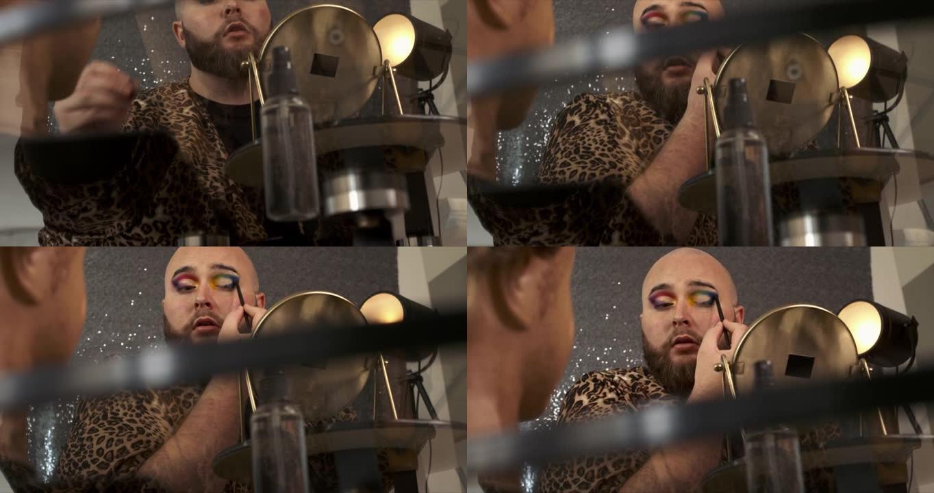 一名男性化妆师混合他的眼影的4k视频片段