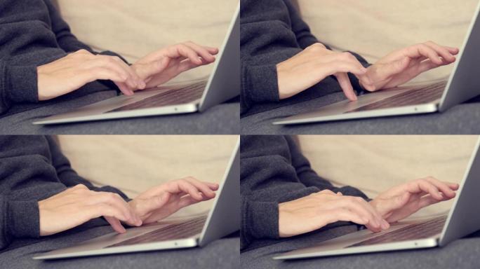 女性手和手指上方笔记本触摸板特写4k视频