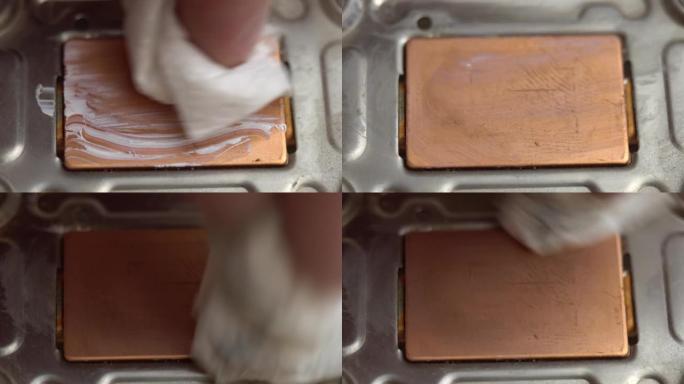 从铜笔记本电脑冷却系统中去除导热膏，用餐巾纸从铜散热器中擦拭导热膏