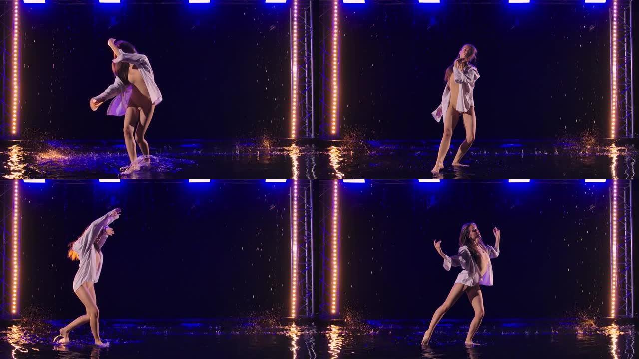 穿着白衬衫和米色紧身衣的女人在雨中跳舞着现代芭蕾舞的戏剧性舞蹈。芭蕾舞演员移动塑料，在黑暗的工作室在