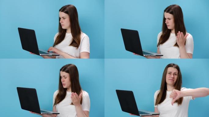 忧心忡忡的20岁年轻女孩在笔记本电脑上张开双手，问什么脏话显示拇指朝下，穿着白色t恤，孤立在蓝色工作