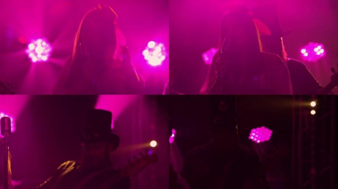 摇滚乐队女歌手的情感现场表演。一群音乐家在黑暗的工作室里在紫色灯光的背景下演奏乐器并唱歌到麦克风中。