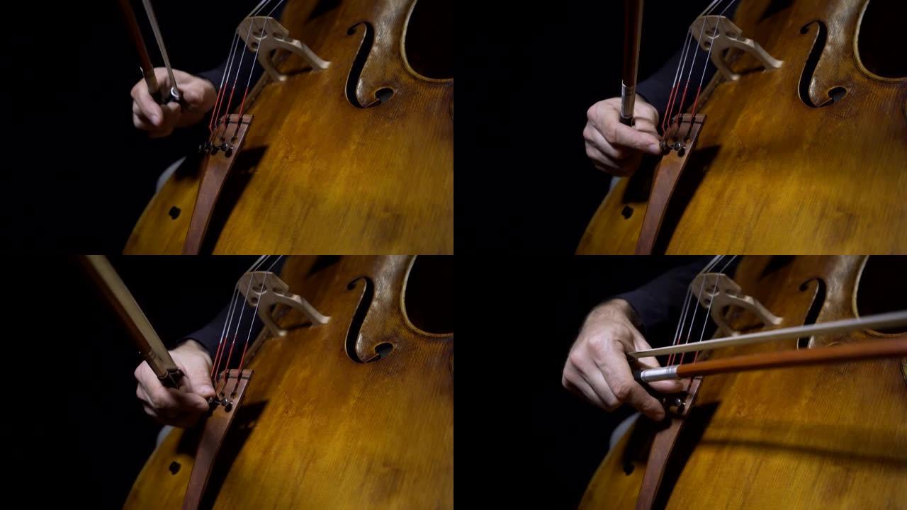 大提琴手调谐大提琴的特写。