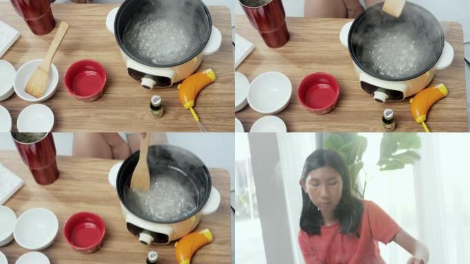 快乐的亚洲女孩你块茎通过智能手机制作视频，在家烹饪一些甜蜜的零食，生活方式概念。