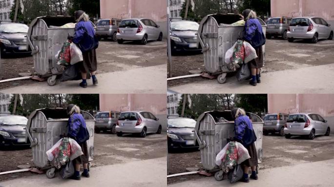 老妇人在垃圾桶里收集二次原料