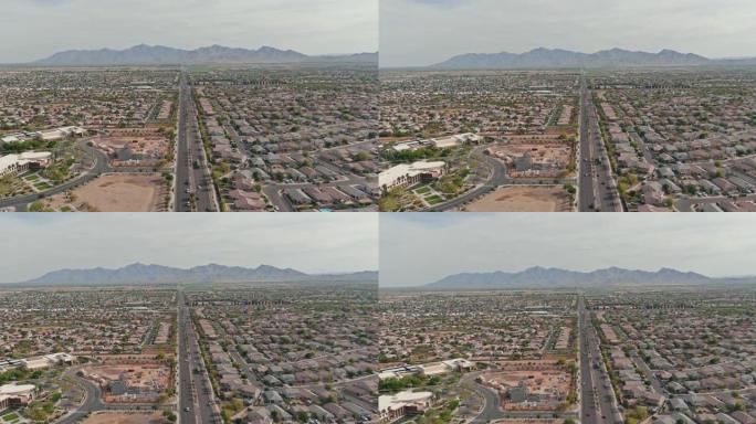 俯瞰沙漠小镇的空中俯瞰美丽的亚利桑那州阿文代尔市，在美国凤凰城附近的州际高速公路上有交通线