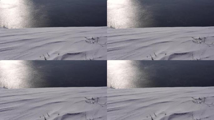 雪背景。新鲜蓬松雪的质地，特写。冬季时间概念