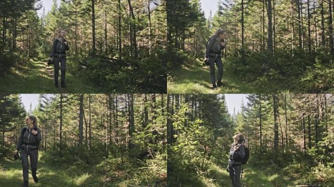 旅行者在森林中拍摄风景。一个白人女人射出漂亮的魔法。女孩在dslr无反光镜相机上拍摄照片视频。