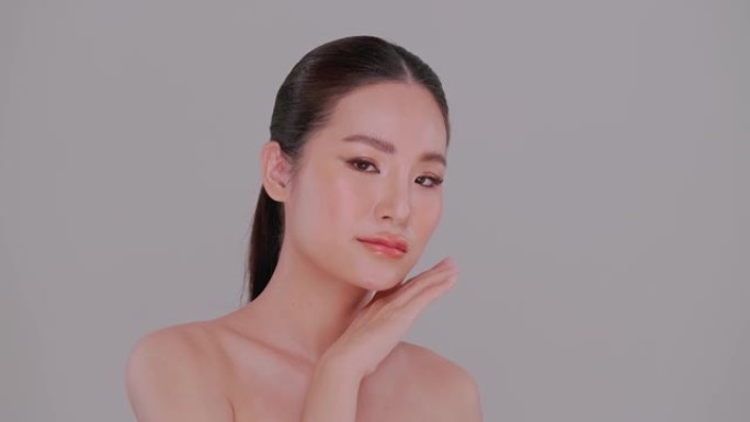 亚洲年轻女子美丽的脸庞，皮肤自然。迷人女孩的肖像，化妆柔和，皮肤白皙。