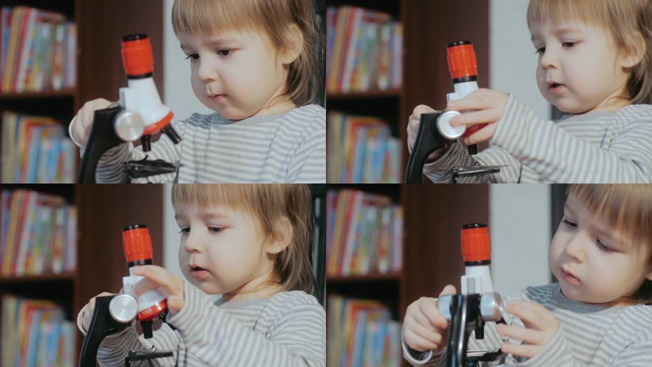 孩子和显微镜。幼儿玩孩子的发育玩具。儿童认知教育玩具。