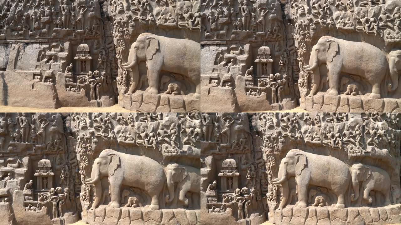 泰米尔纳德邦Mahabalipuram的整体岩石面板上的古代历史神，人类和动物雕塑的石雕。马哈巴利普