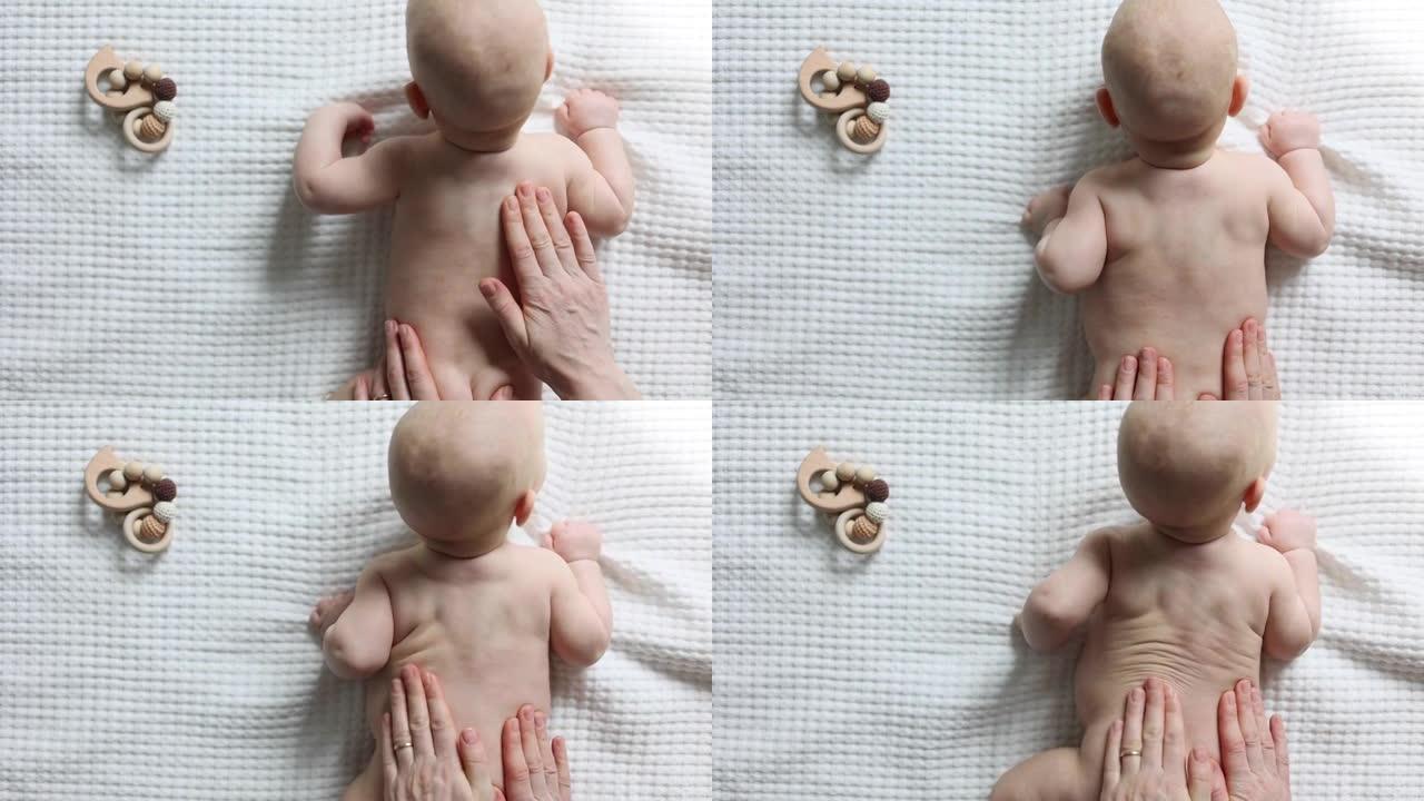 婴儿背部抚摸手的按摩技术