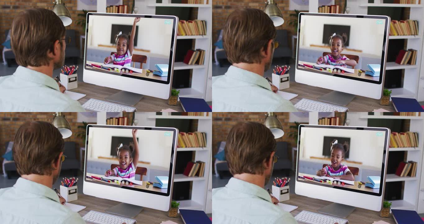 白人男老师坐在办公桌前使用计算机上在线学校课程