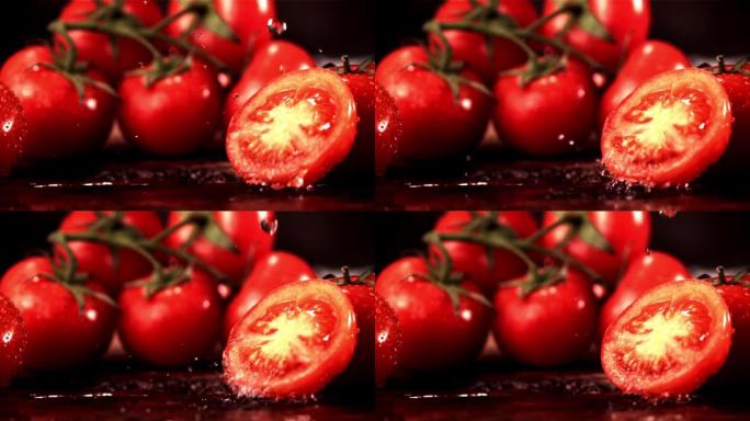 超级慢动作在一块西红柿上落下水滴。以1000 fps的高速相机拍摄。