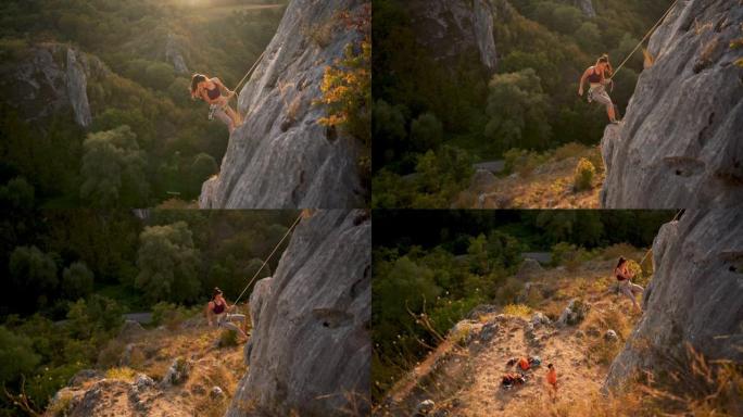 一名女性登山者在岩石山上移动的高角度视图