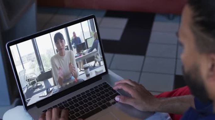 非裔美国商人使用笔记本电脑与女同事进行视频通话