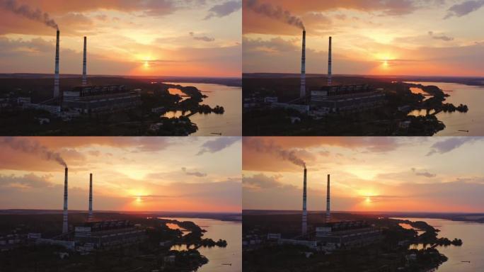 河边有烟囱的工业炼油厂。工业区令人惊叹的日落。从上方观看。德龙的视频。