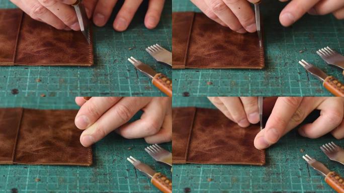 皮革持卡人的制造过程。用金属打孔器在皮革工件上打孔。手工皮革制品。爱好概念。
