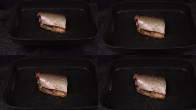 在深锅中油炸的红鱼片，带有不粘涂层