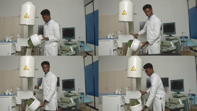 英俊的年轻自信专注的非洲男子医生，穿着白色制服，在现代诊所用超声波碎石机工作。肾结石治疗理念