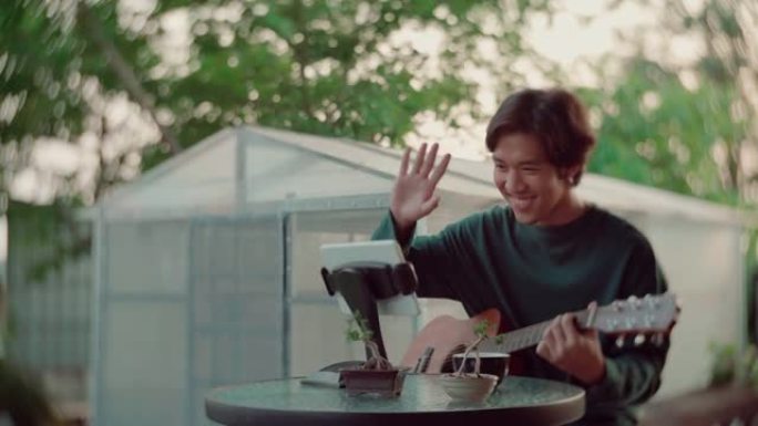 亚洲男子通过互联网上的视频通话一起演奏音乐