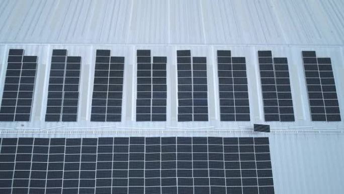 安装太阳能电池板的技术人员的空中俯视图