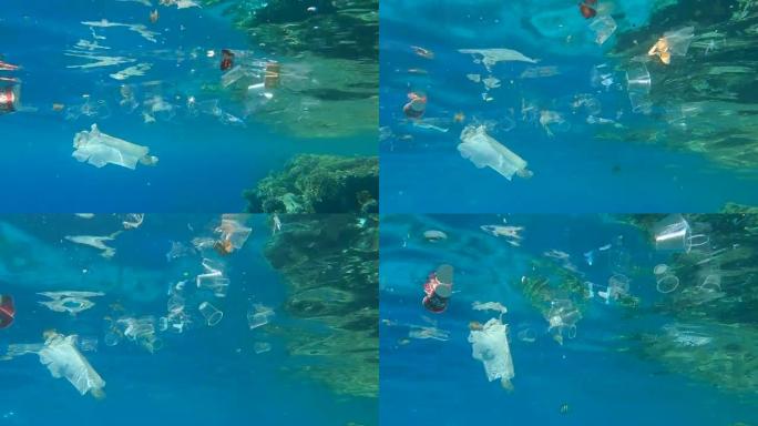 许多塑料垃圾被地表水反射的水漂浮。水下射击，海洋的塑料污染。红海的大规模塑料污染 (4K - 60f