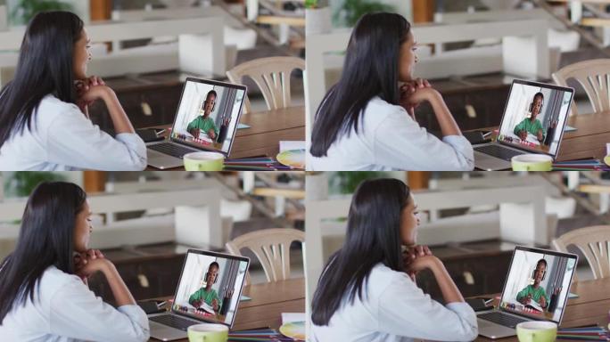 非裔美国女教师在家里的笔记本电脑上与非裔美国男孩进行视频通话