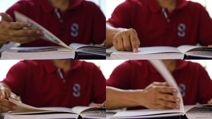 4k延时，穿着红色polo衫的男人，阅读课本以学习新知识，教育理念。