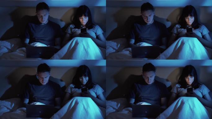 小工具夜数码情侣使用手机笔记本电脑床