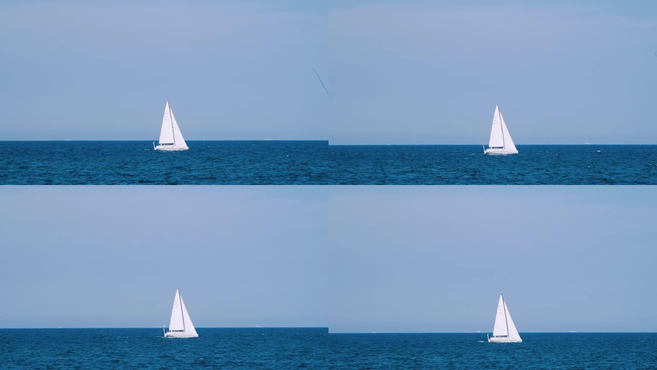漂浮在海上的船。在公海航行有三角帆的帆船