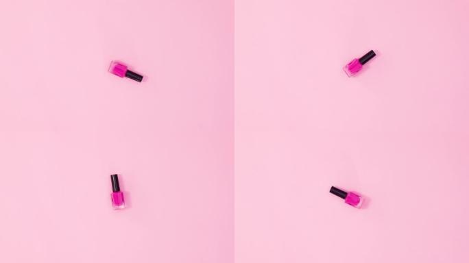 美甲指甲油瓶在柔和的粉红色背景上旋转。停止运动平铺